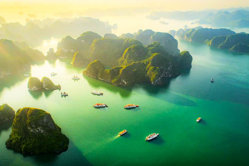 Sail through Vietnam’s iconic limestone karsts at sunrise