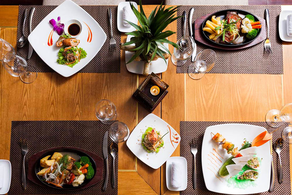 Savor gourmet dining with panoramic views of Halong Bay