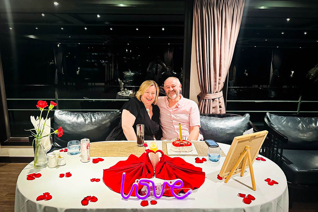 Smiling together on a luxury Halong Bay cruise