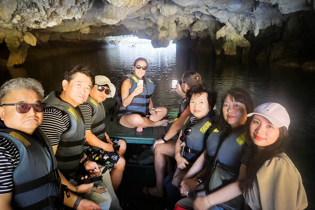 Navigate tranquil waters surrounded by magnificent karst formations
