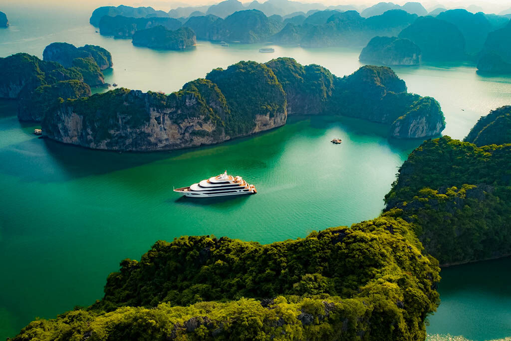 Wake up to panoramic bay views from your elegant cabin aboard Scarlet Pearl