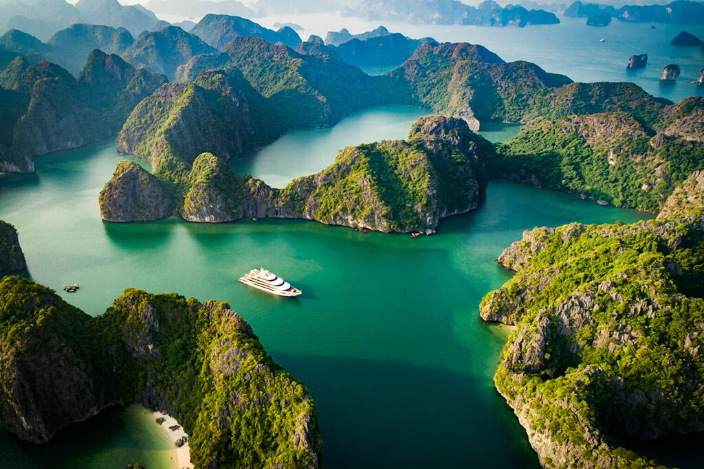 Wake up to panoramic bay views from your elegant cabin aboard Scarlet Pear