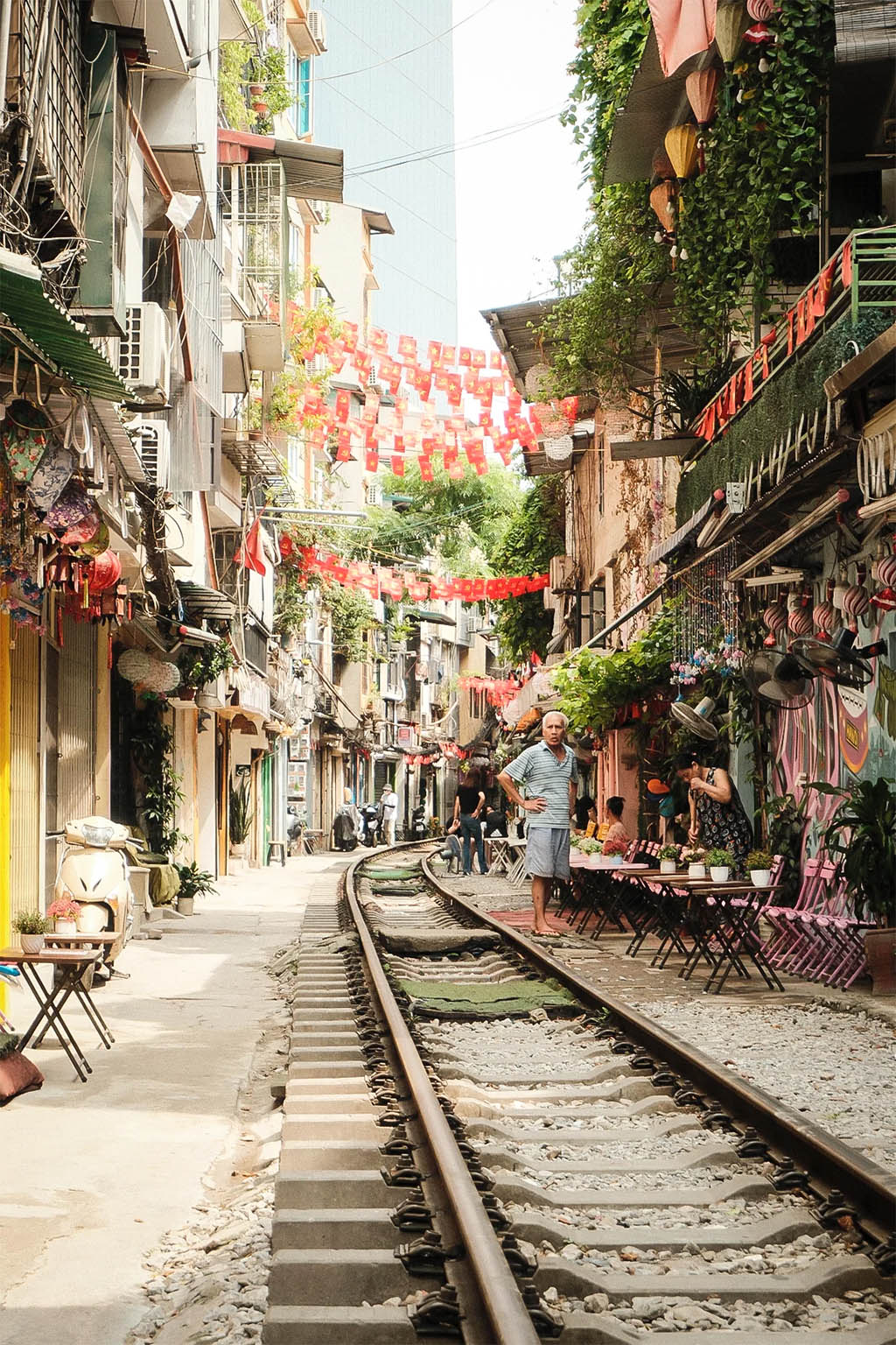 Capture the thrilling view of trains passing through narrow streets