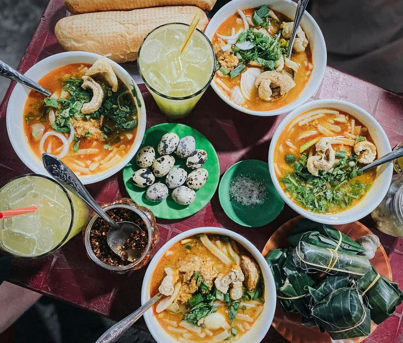 Explore bánh canh cua spots on an eco-friendly tour