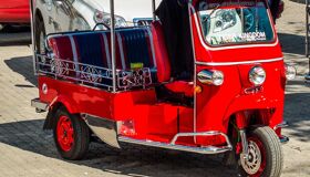 Red Tuk Tuk on the street of Siem Reap