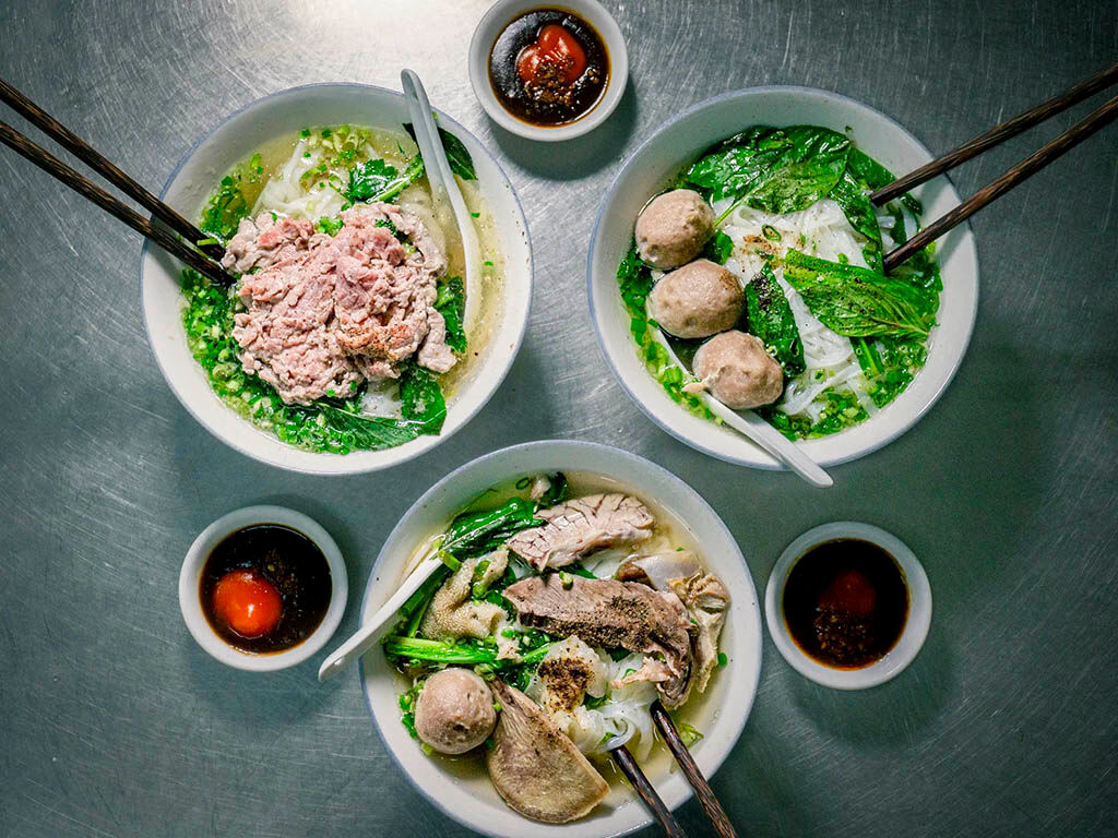 Savor authentic Vietnamese pho from a local stall
