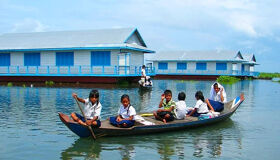 Tonle Sap Kayaking Children going to schoo