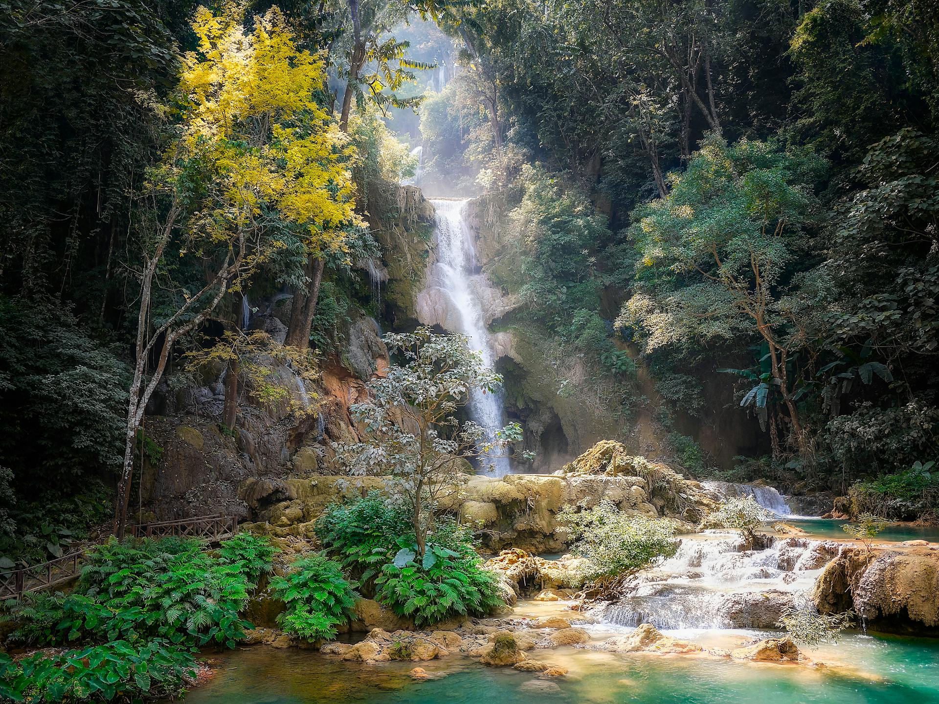 Begin your exploration with Kuang Si’s tranquil ambiance