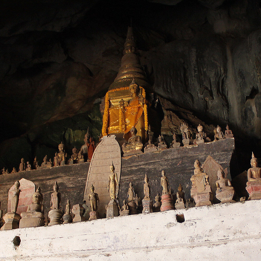 Explore thousands of Buddha statues in riverside caves