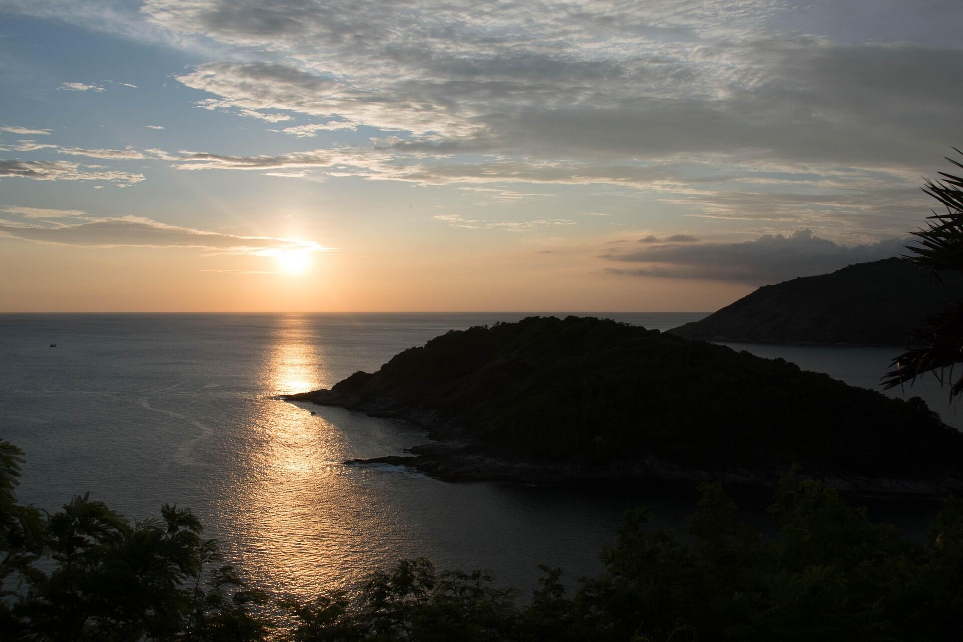 Relax on Phuket’s iconic bustling beach at sunset
