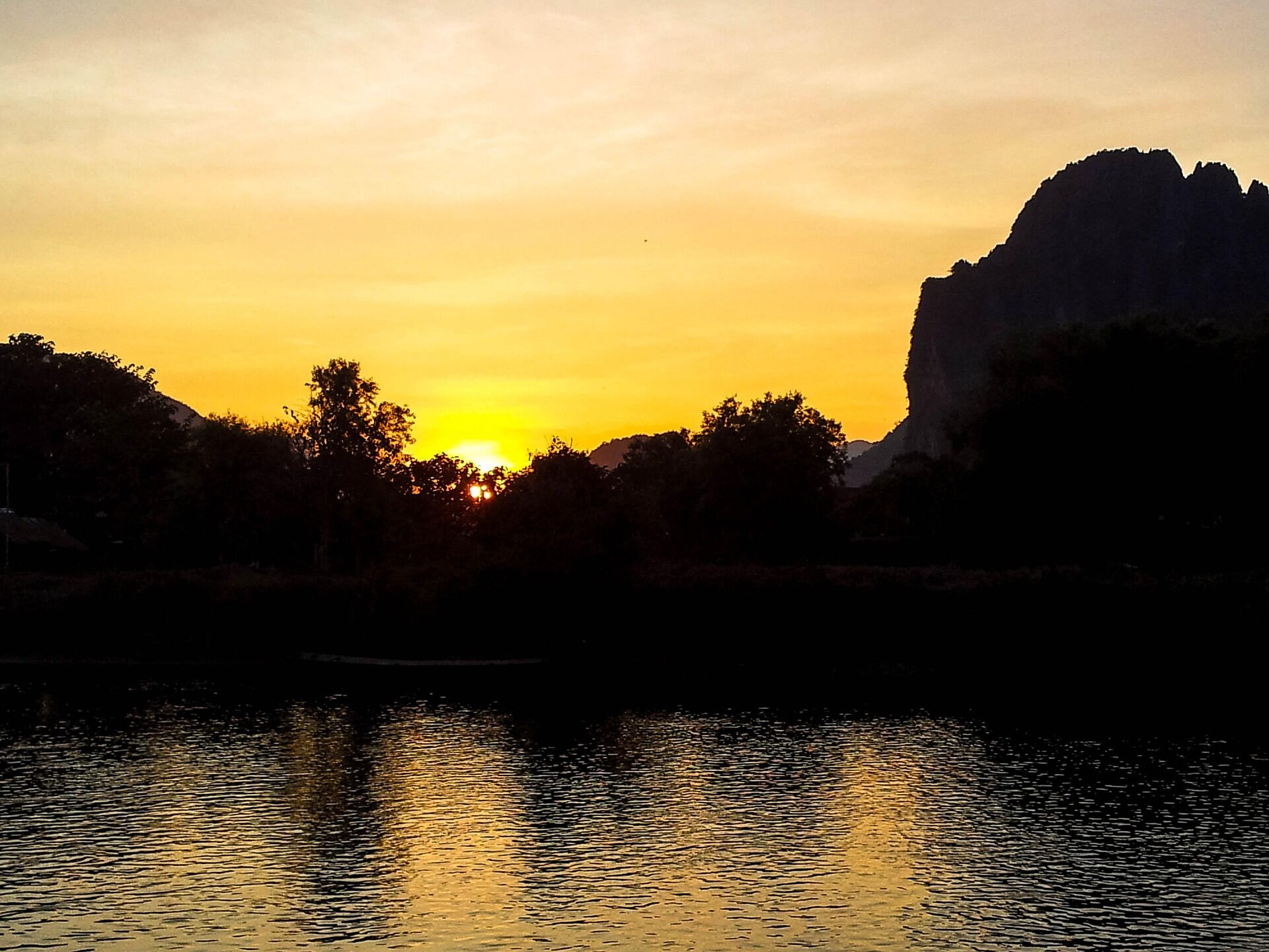 Begin your exploration with Vang Vieng’s tranquil ambiance